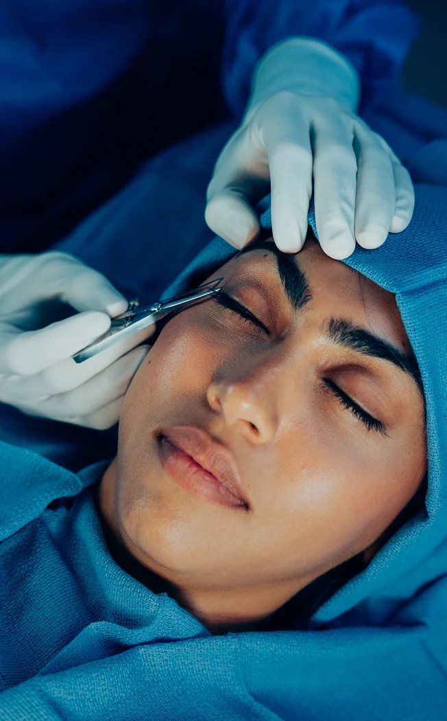 Dr Sameer Halani MD performing facial cosmetic procedure on female patient in clinical setting - eyes in New York , NY
