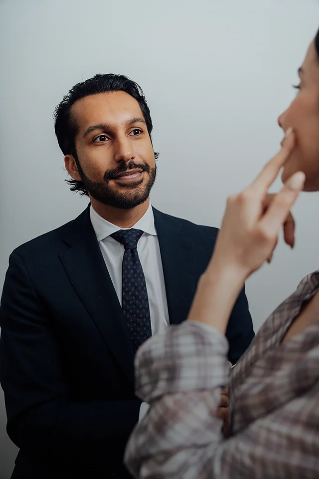 Sameer Halani MD in suit listening attentively to colleague during business meeting or consultation - Face in New York , NY