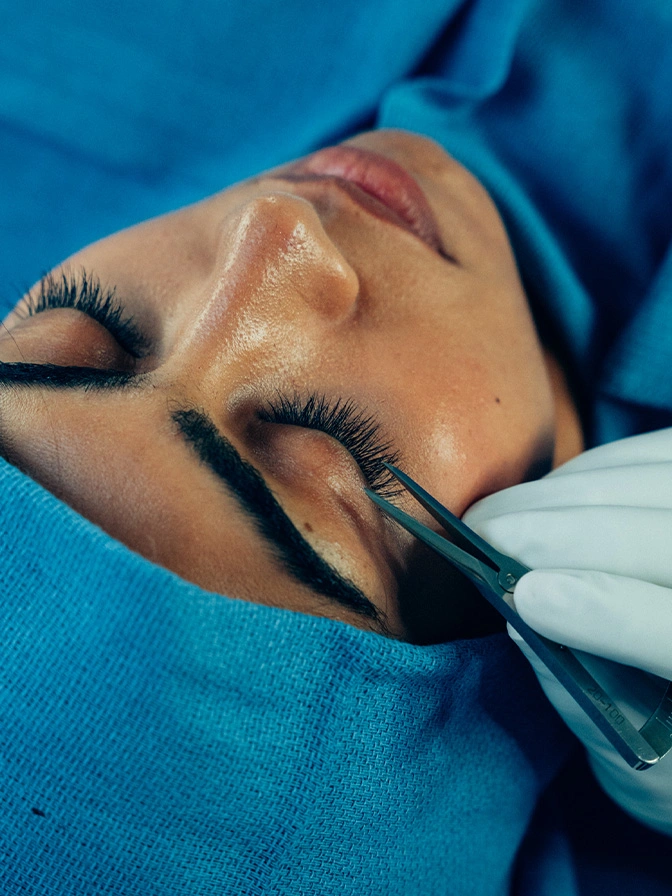 Dr Sameer Halani marking woman's eyebrow with surgical pen before microblading or brow lift procedure - Canthopexy and Canthoplasty in New York , NY